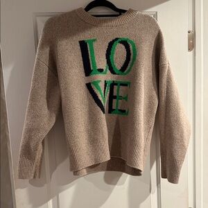 Target Beige Sweater with Green and Black 'LOVE' Design